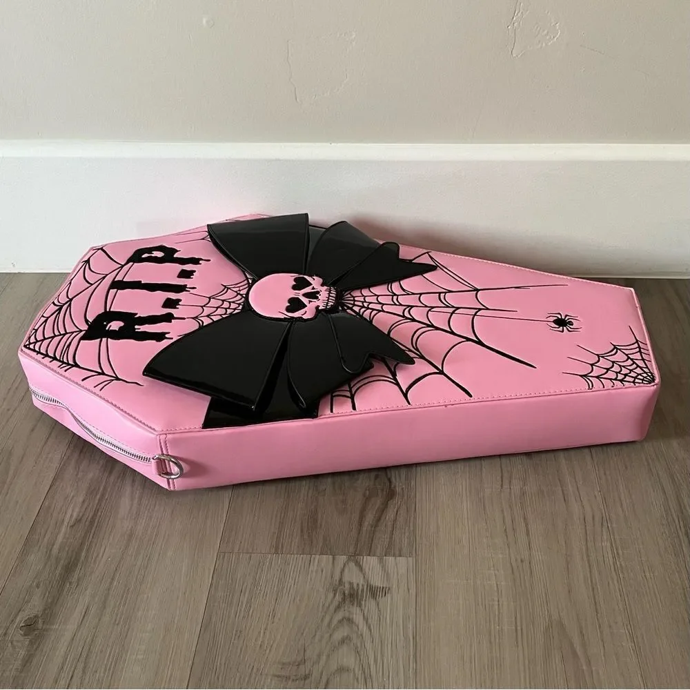 Dolls Kill oversize pink and black skull spiderweb coffin backpack. New in box